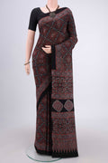Black Maheshwari Silk Cotton Saree with Ajrakh Print on the body and Plain Border.  displayed on a mannequin