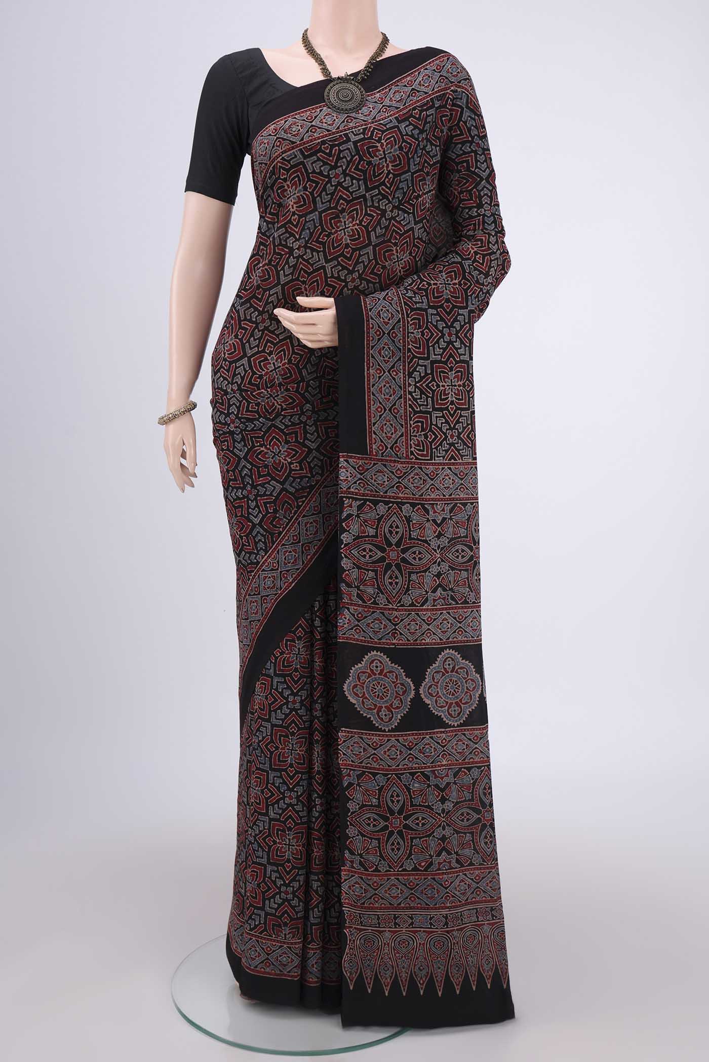 Black Maheshwari Silk Cotton Saree with Ajrakh Print on the body and Plain Border.  displayed on a mannequin