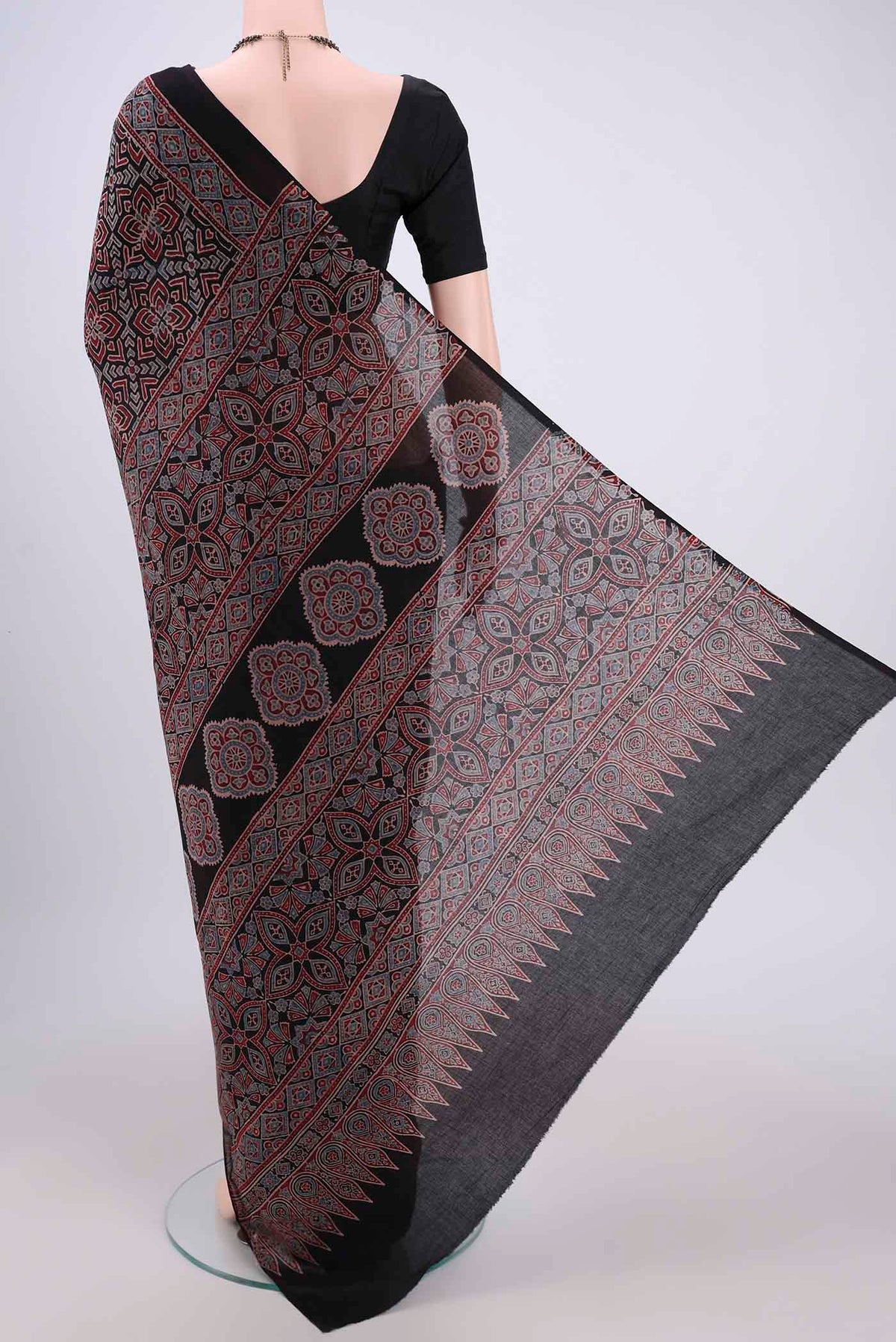 Flat view of Black Maheshwari Silk Cotton Saree with Ajrakh Print on the body and Plain Border. 