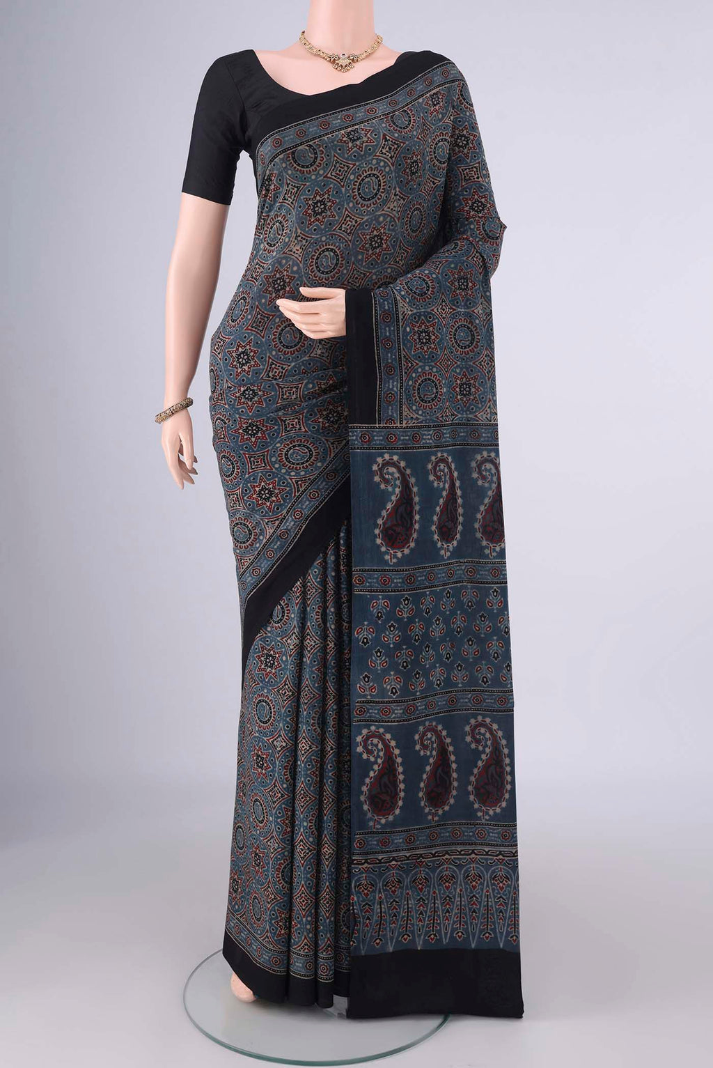 Indigo Cotton Saree with Ajrakh Print on the body and Printed Border.  displayed on a mannequin