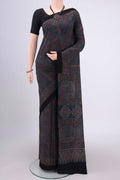 Light Blue Maheshwari Silk Cotton Saree with Ajrakh Print on the body and Plain Border.  displayed on a mannequin