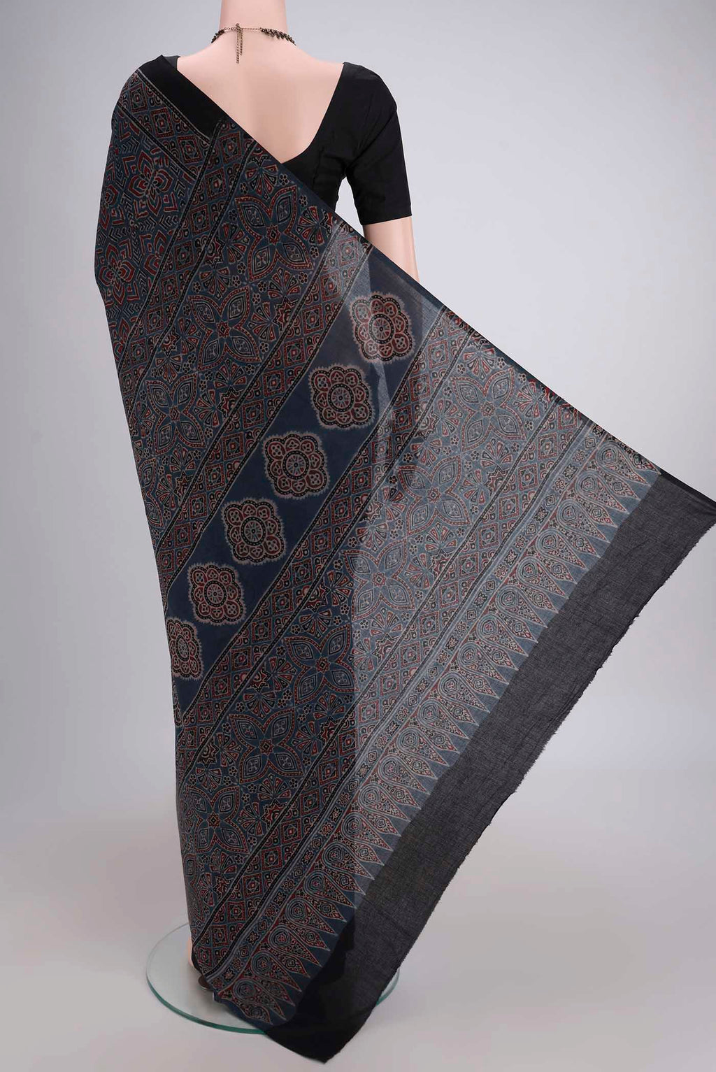 Flat view of Light Blue Maheshwari Silk Cotton Saree with Ajrakh Print on the body and Plain Border. 