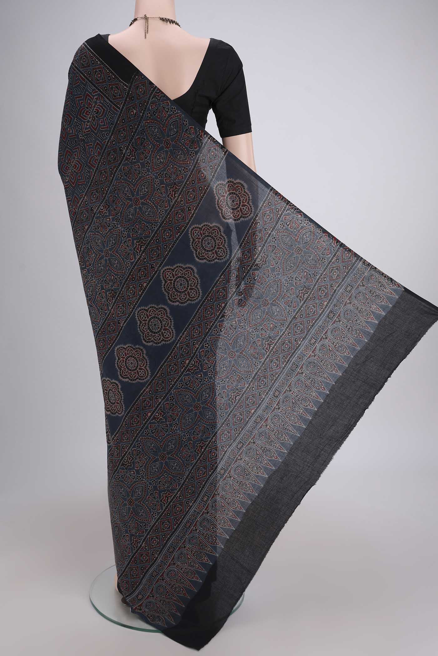 Flat view of Light Blue Maheshwari Silk Cotton Saree with Ajrakh Print on the body and Plain Border. 