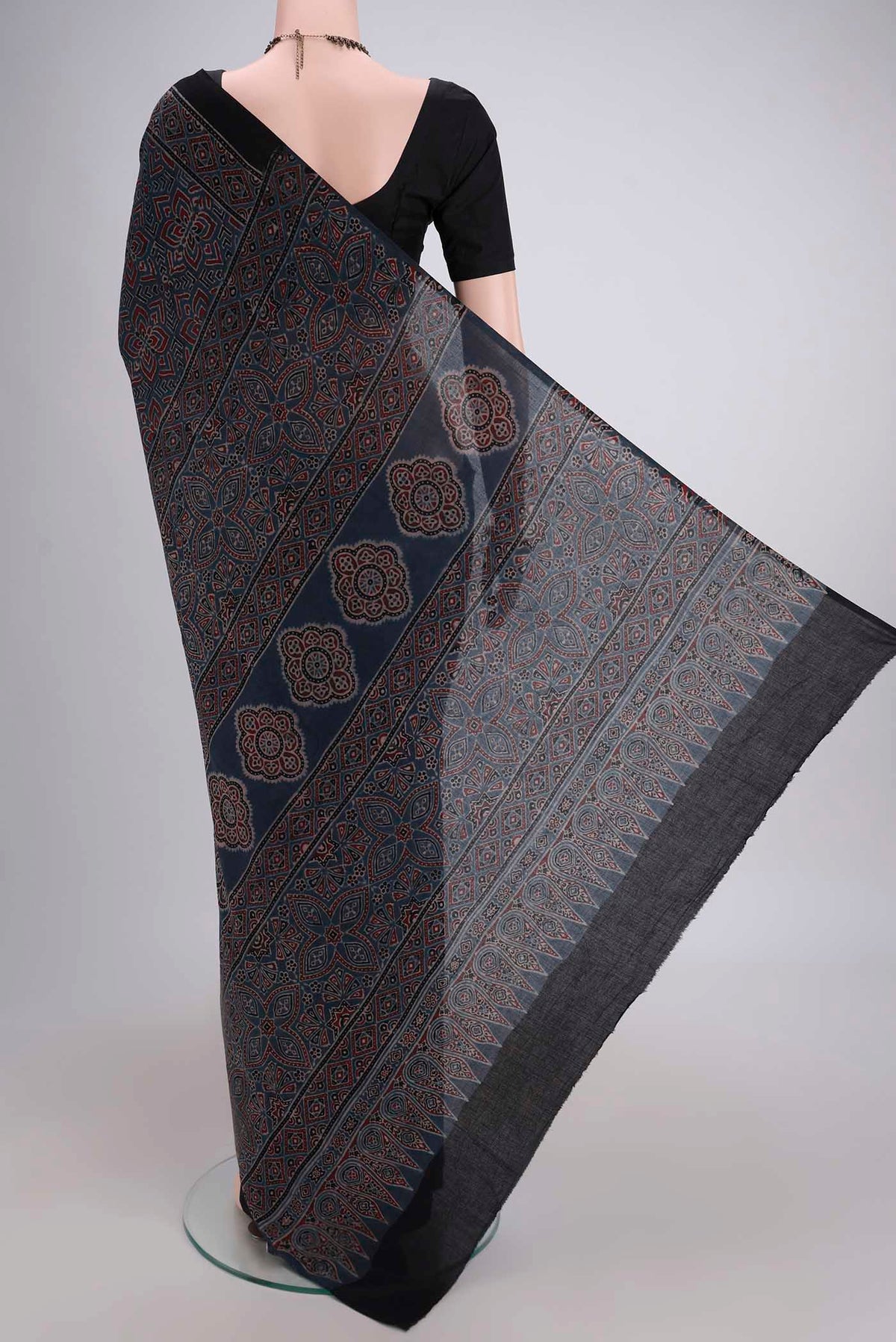 Flat view of Light Blue Maheshwari Silk Cotton Saree with Ajrakh Print on the body and Plain Border. 