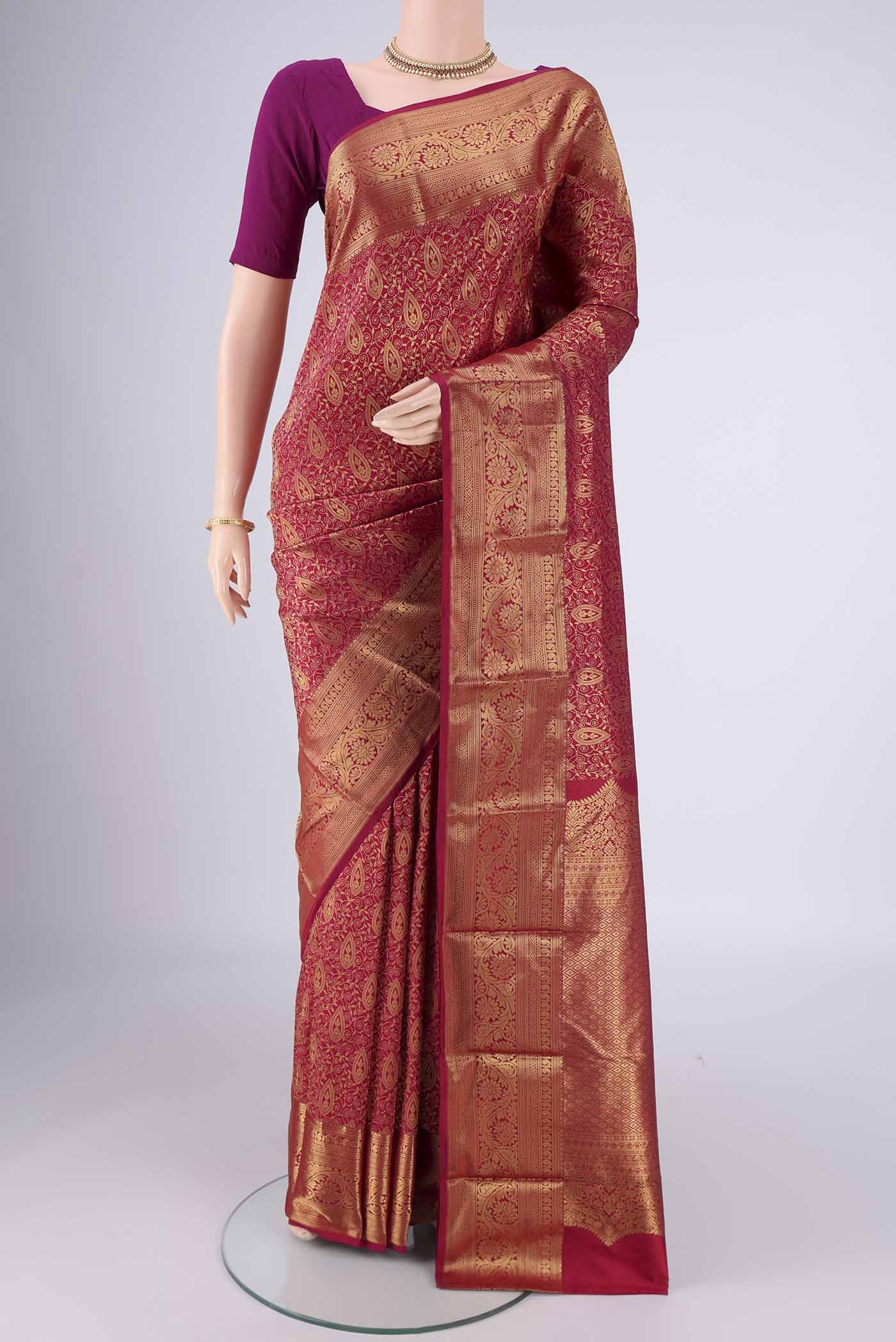 Maroon Bangalore Silk Saree with Zari Brocade on the body and Zari Border.  displayed on a mannequin