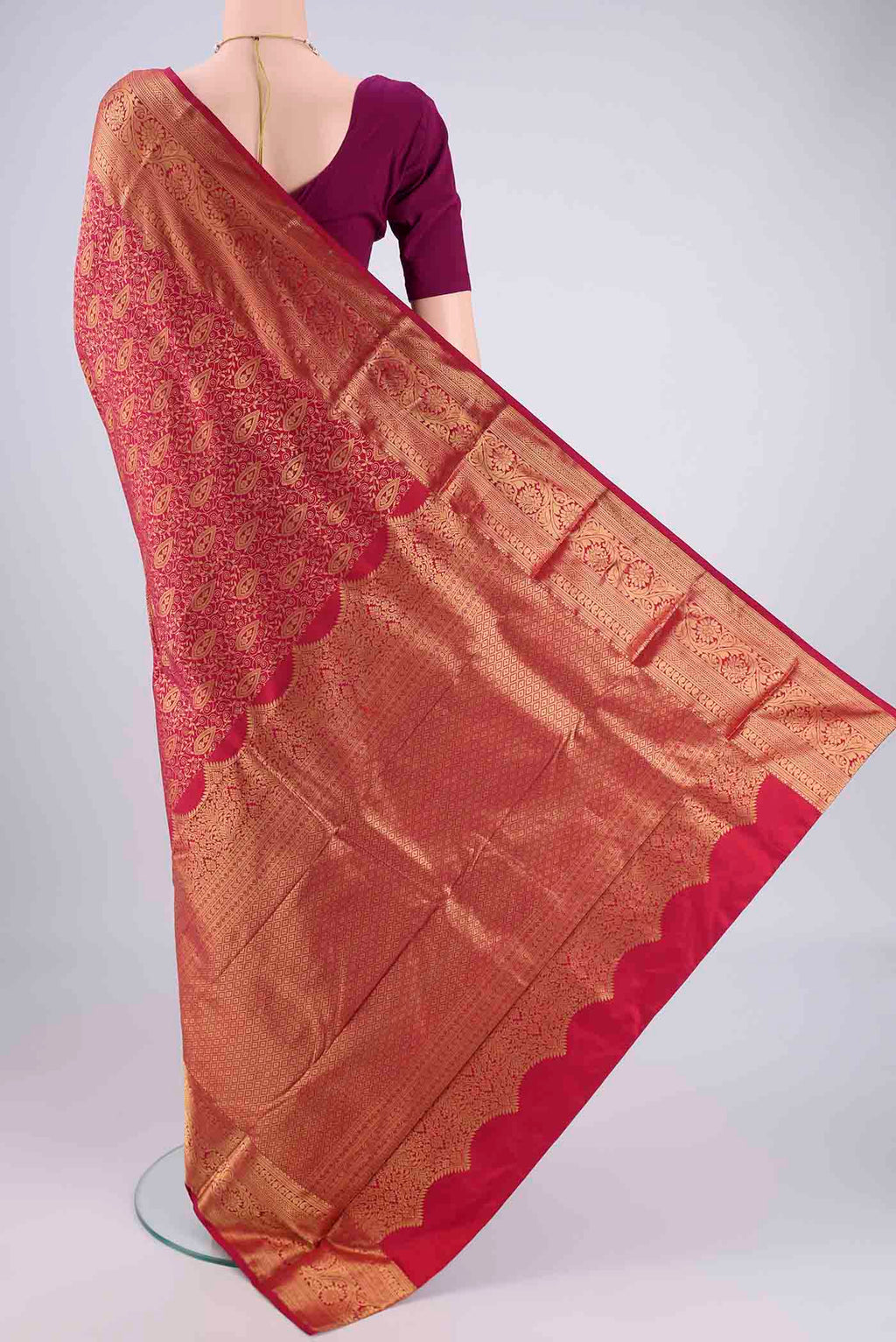 Flat view of Maroon Bangalore Silk Saree with Zari Brocade on the body and Zari Border. 