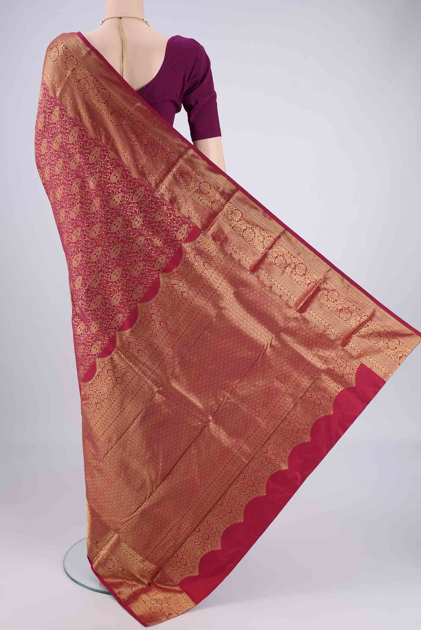 Flat view of Maroon Bangalore Silk Saree with Zari Brocade on the body and Zari Border. 
