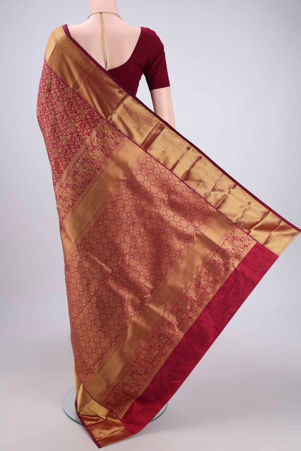 Flat view of Maroon Bangalore Silk Saree with Zari Brocade on the body and Zari Border. 