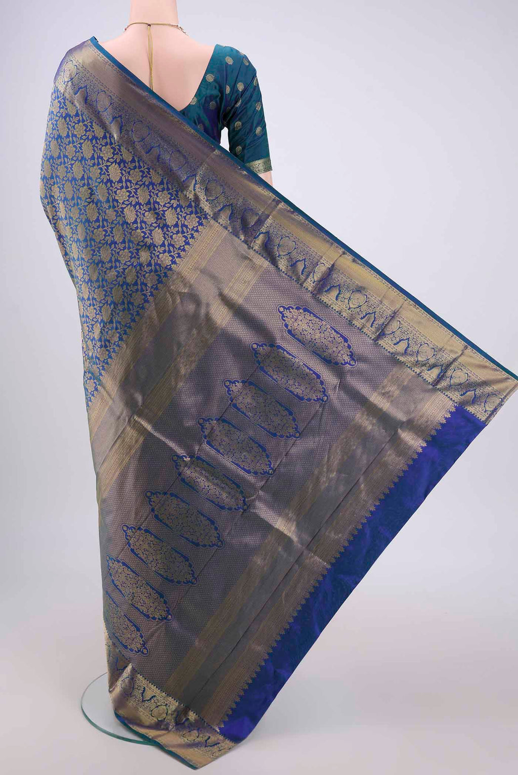 Flat view of Blue Dual Tone Bangalore Silk Saree with Zari Brocade on the body and Zari Border. 