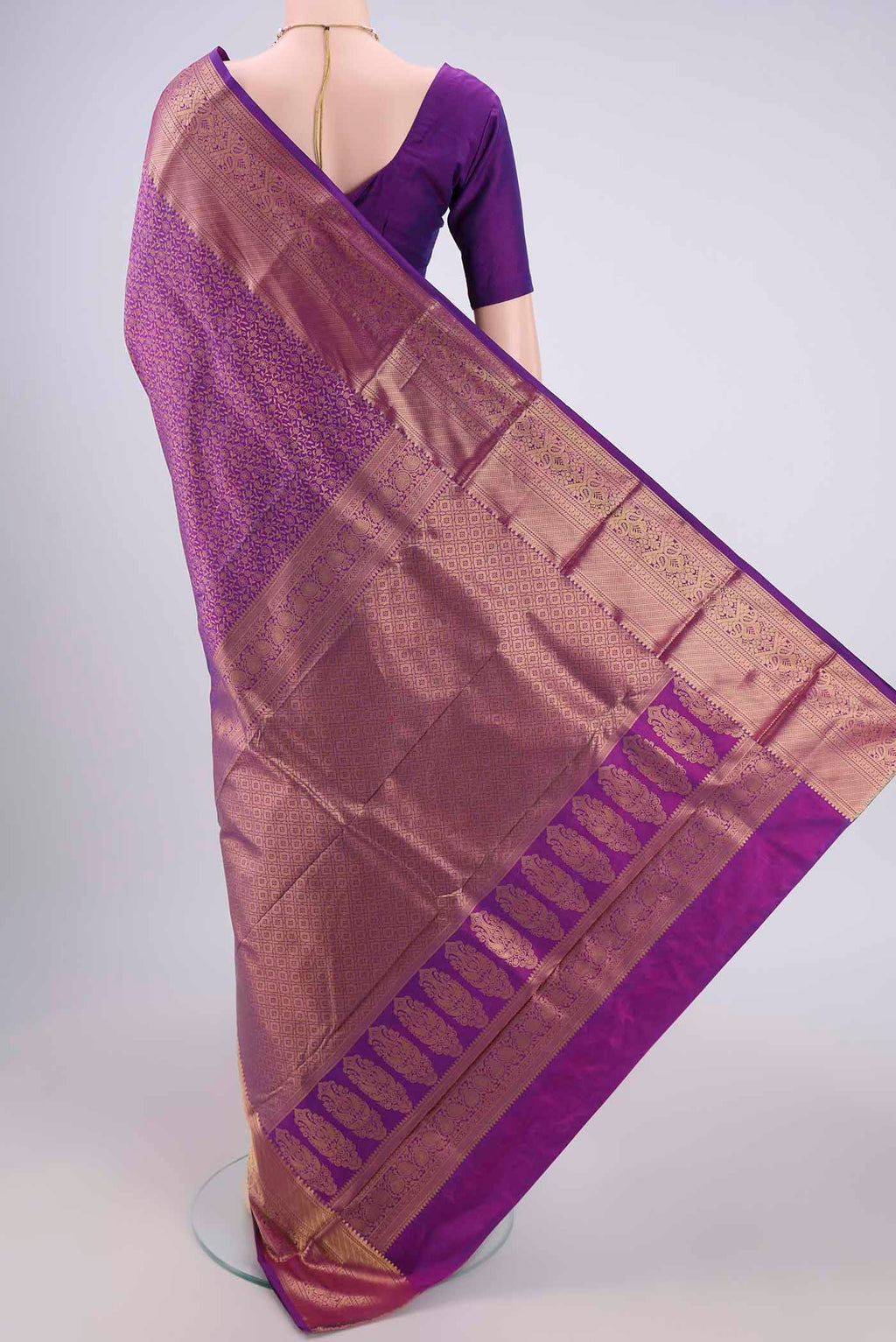 Flat view of Purple Bangalore Silk Saree with Zari Brocade on the body and Zari Border. 