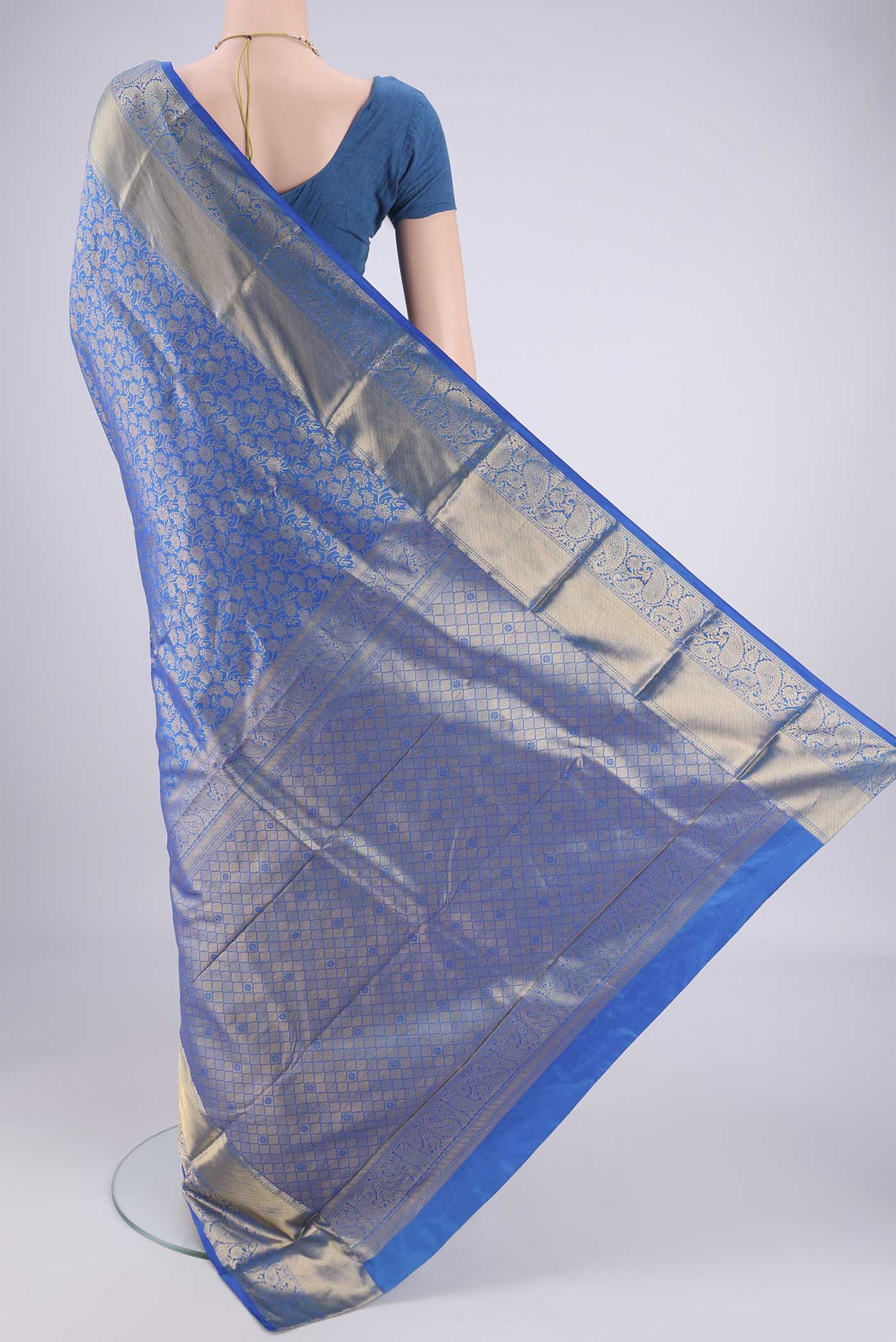 Flat view of Blue Bangalore Silk Saree with Zari Brocade on the body and Zari Border. 