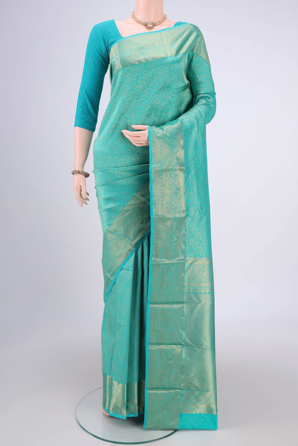 Turquoise Dual Tone Bangalore Silk Saree with Zari Brocade on the body and Zari Border.  displayed on a mannequin