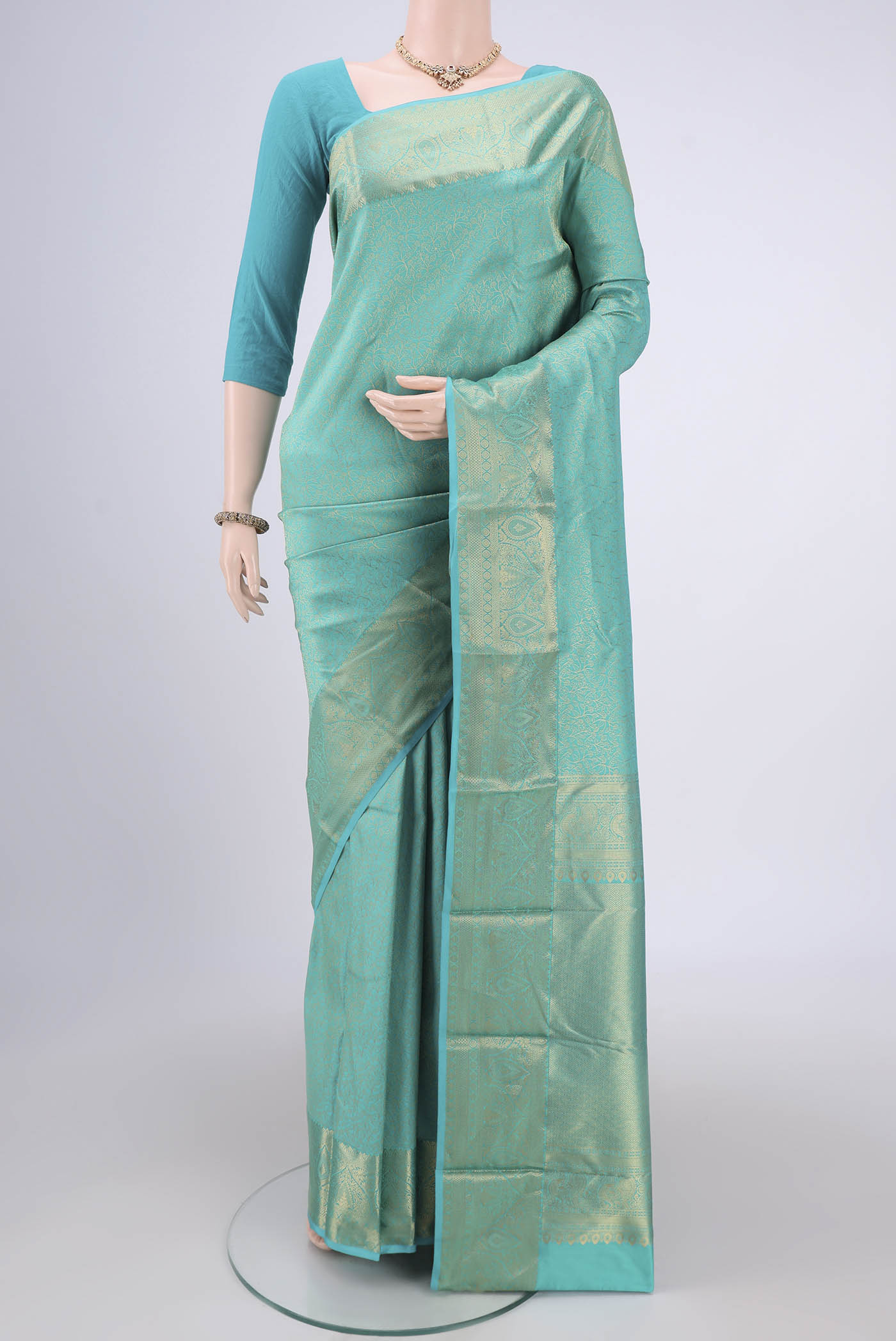 Turquoise Dual Tone Bangalore Silk Saree with Zari Brocade on the body and Zari Border.  displayed on a mannequin