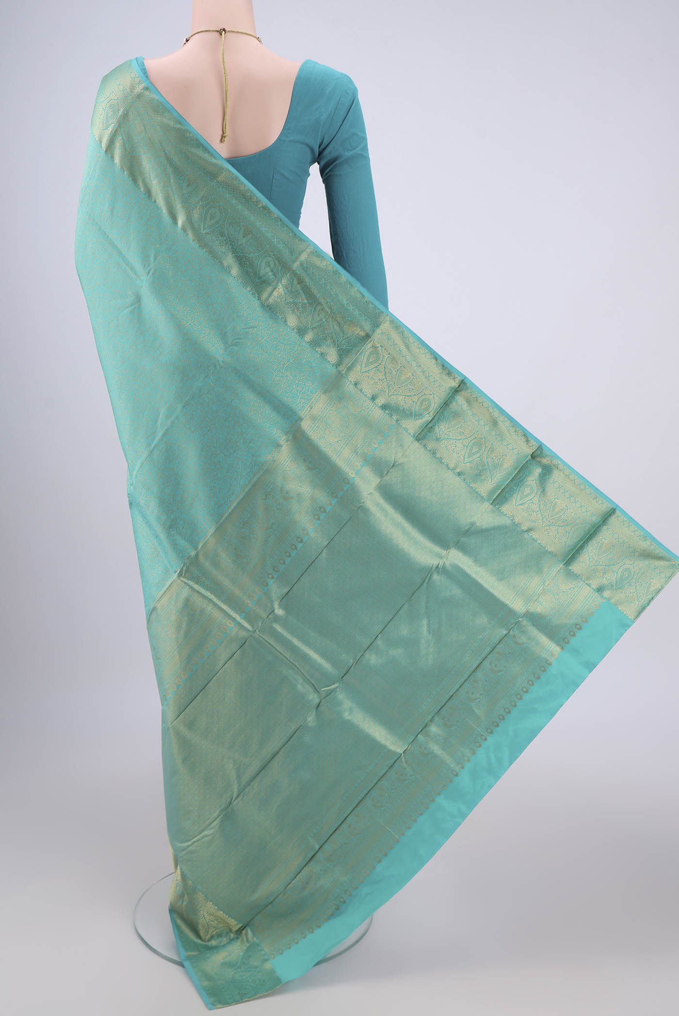 Flat view of Turquoise Dual Tone Bangalore Silk Saree with Zari Brocade on the body and Zari Border. 