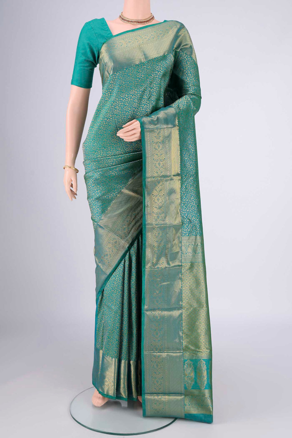 Sea Green Bangalore Silk Saree with Zari Brocade on the body and Zari Border.  displayed on a mannequin
