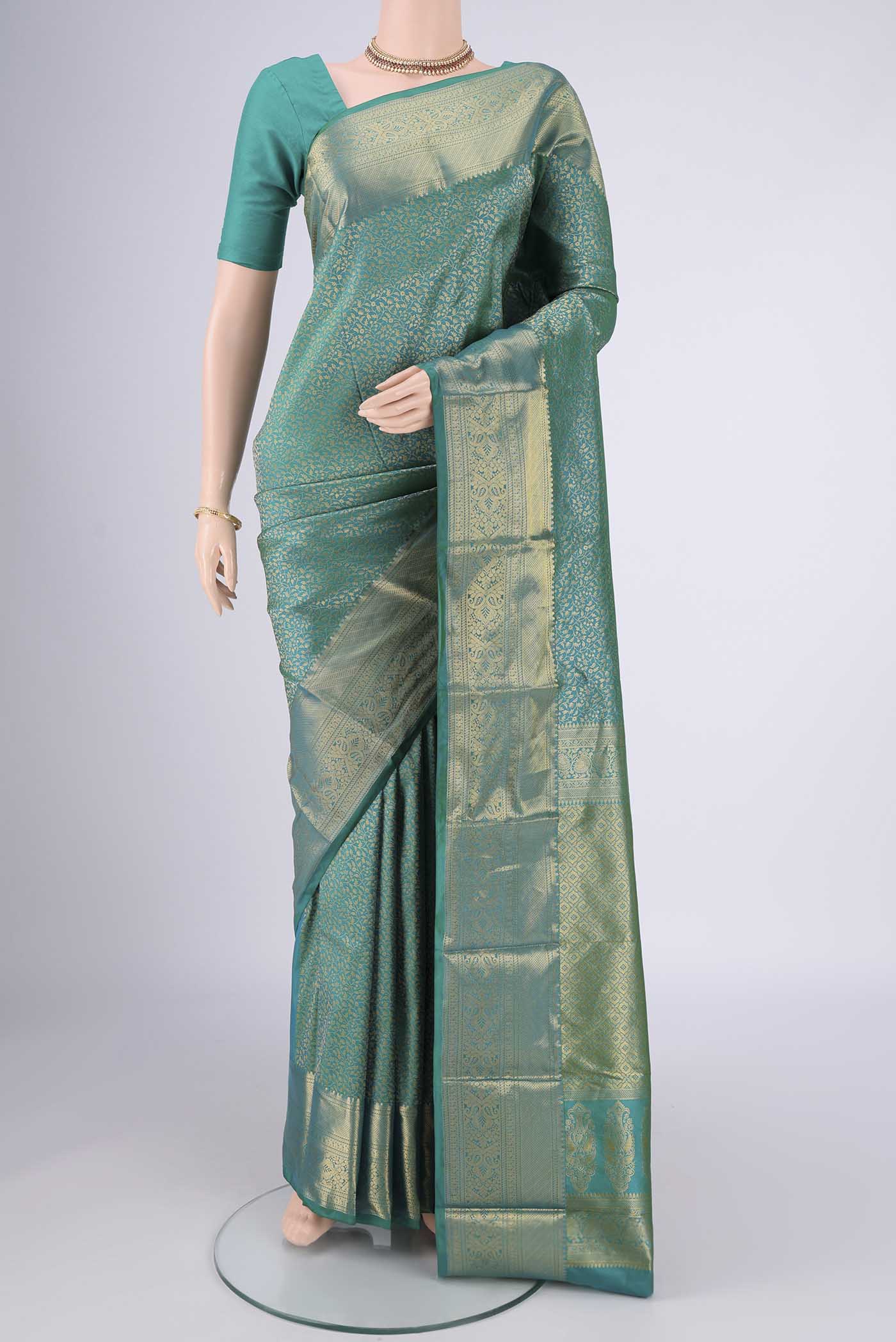 Sea Green Bangalore Silk Saree with Zari Brocade on the body and Zari Border.  displayed on a mannequin