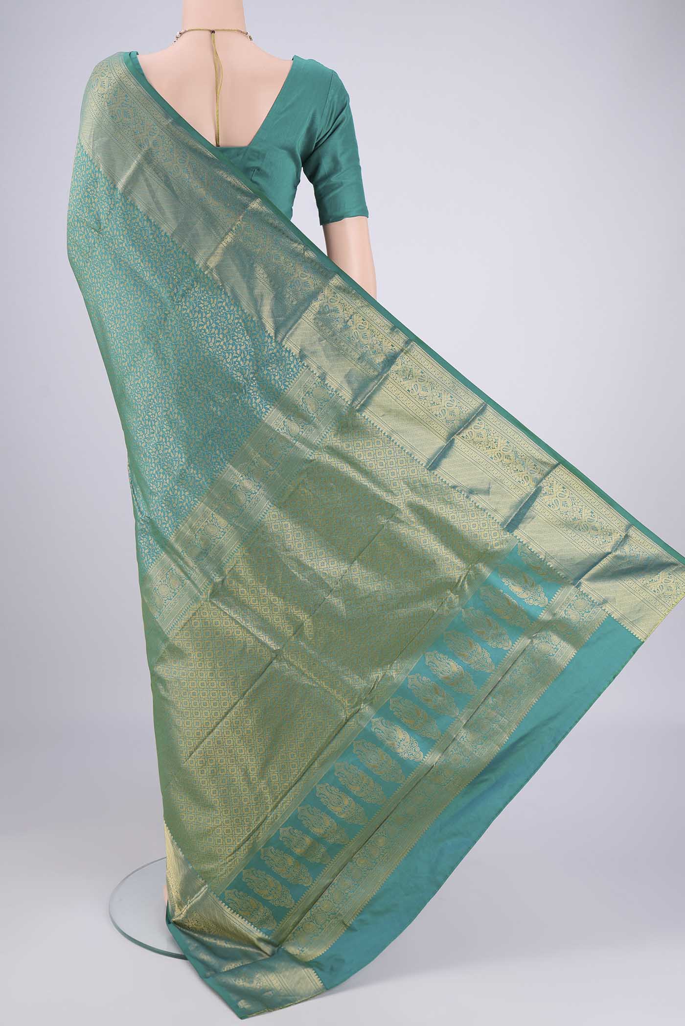 Flat view of Sea Green Bangalore Silk Saree with Zari Brocade on the body and Zari Border. 