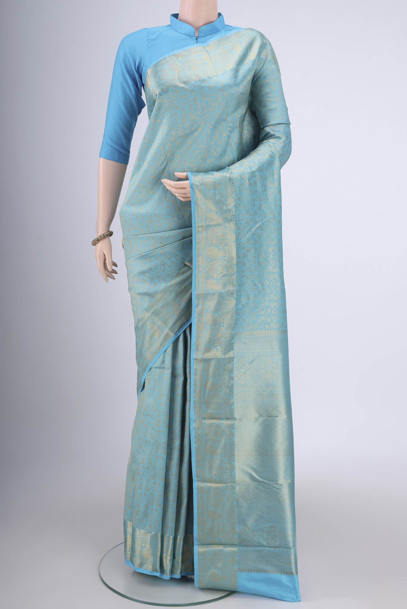 Sky Blue Bangalore Silk Saree with Zari Brocade on the body and Zari Border.  displayed on a mannequin