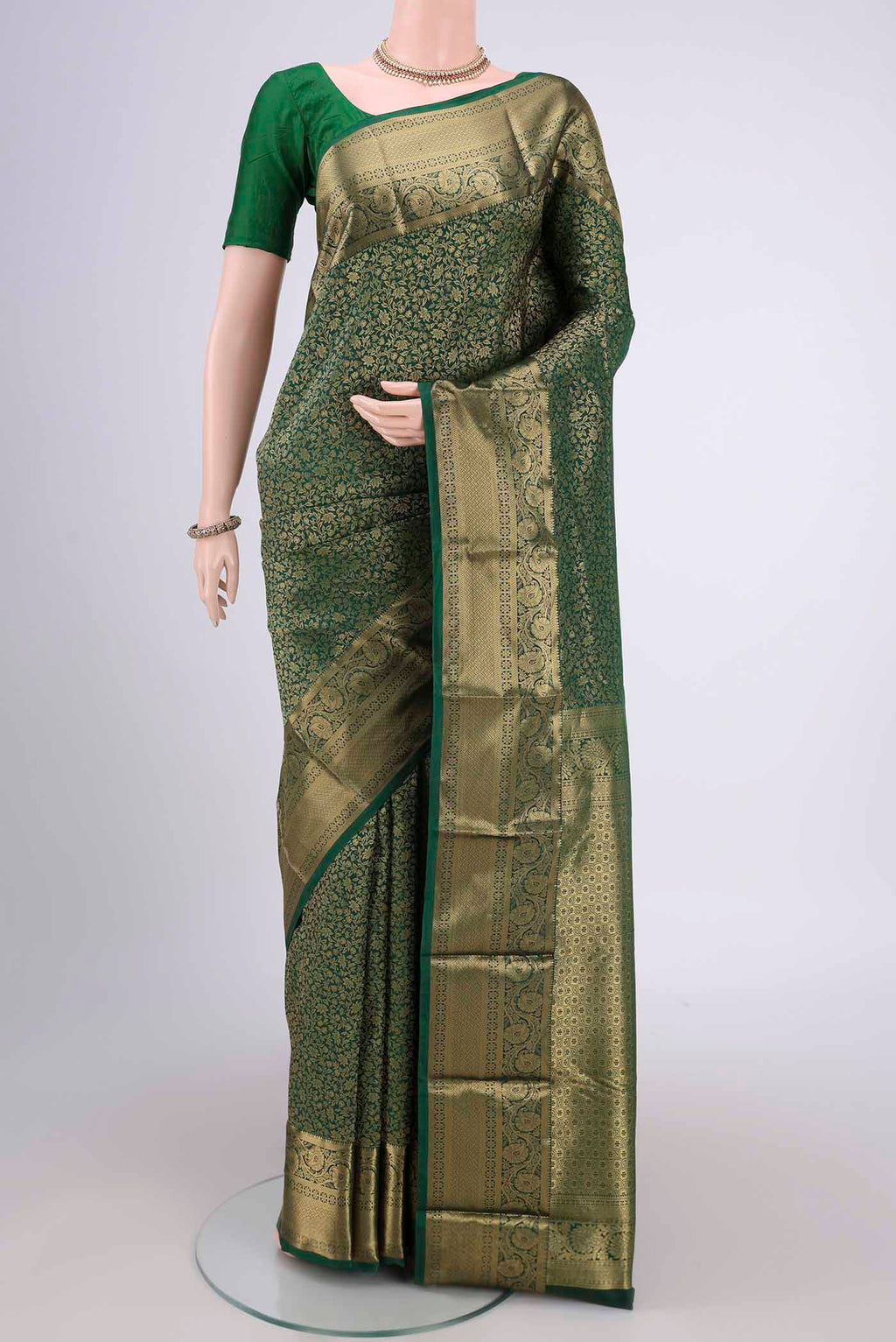 Bottle Green Dual Tone Bangalore Silk Saree with Zari Brocade on the body and Zari Border.  displayed on a mannequin