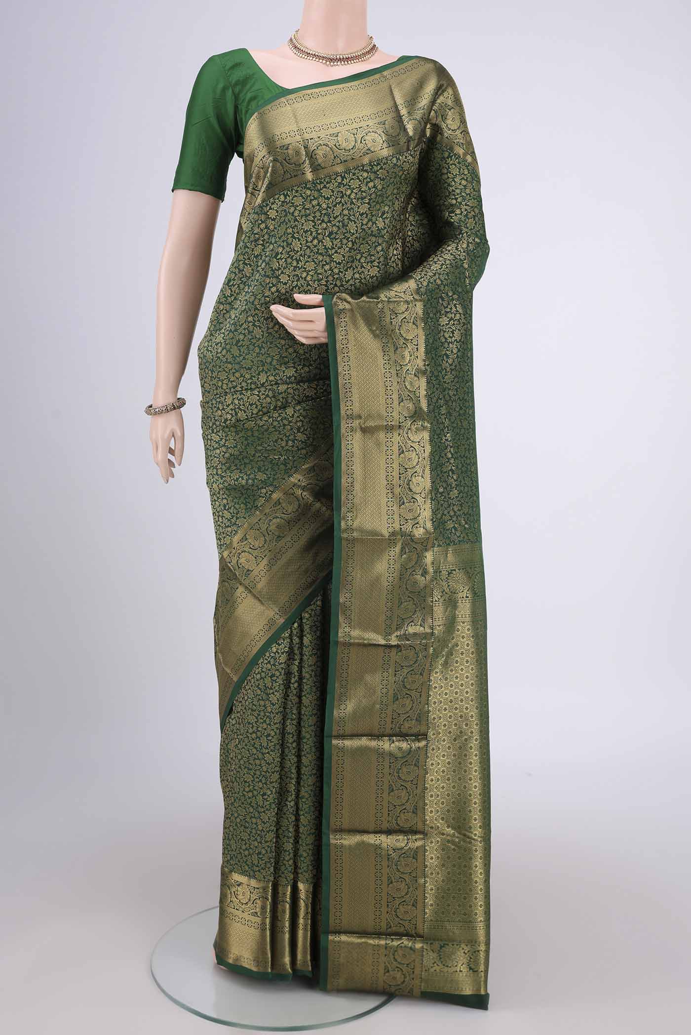 Bottle Green Dual Tone Bangalore Silk Saree with Zari Brocade on the body and Zari Border.  displayed on a mannequin
