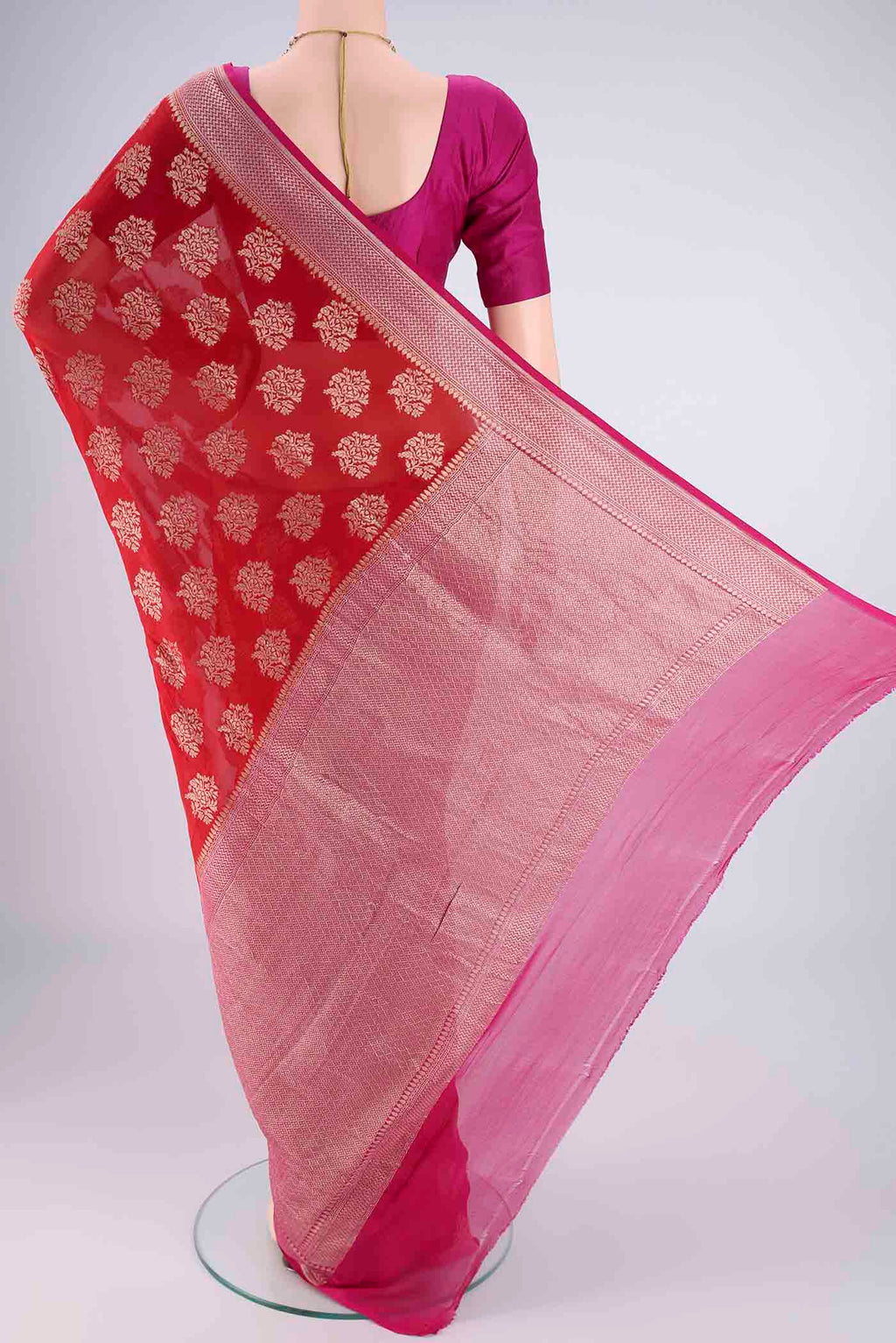 Flat view of Red Banarasi Georgette Saree with Zari Brocade on the body and Zari Border. 