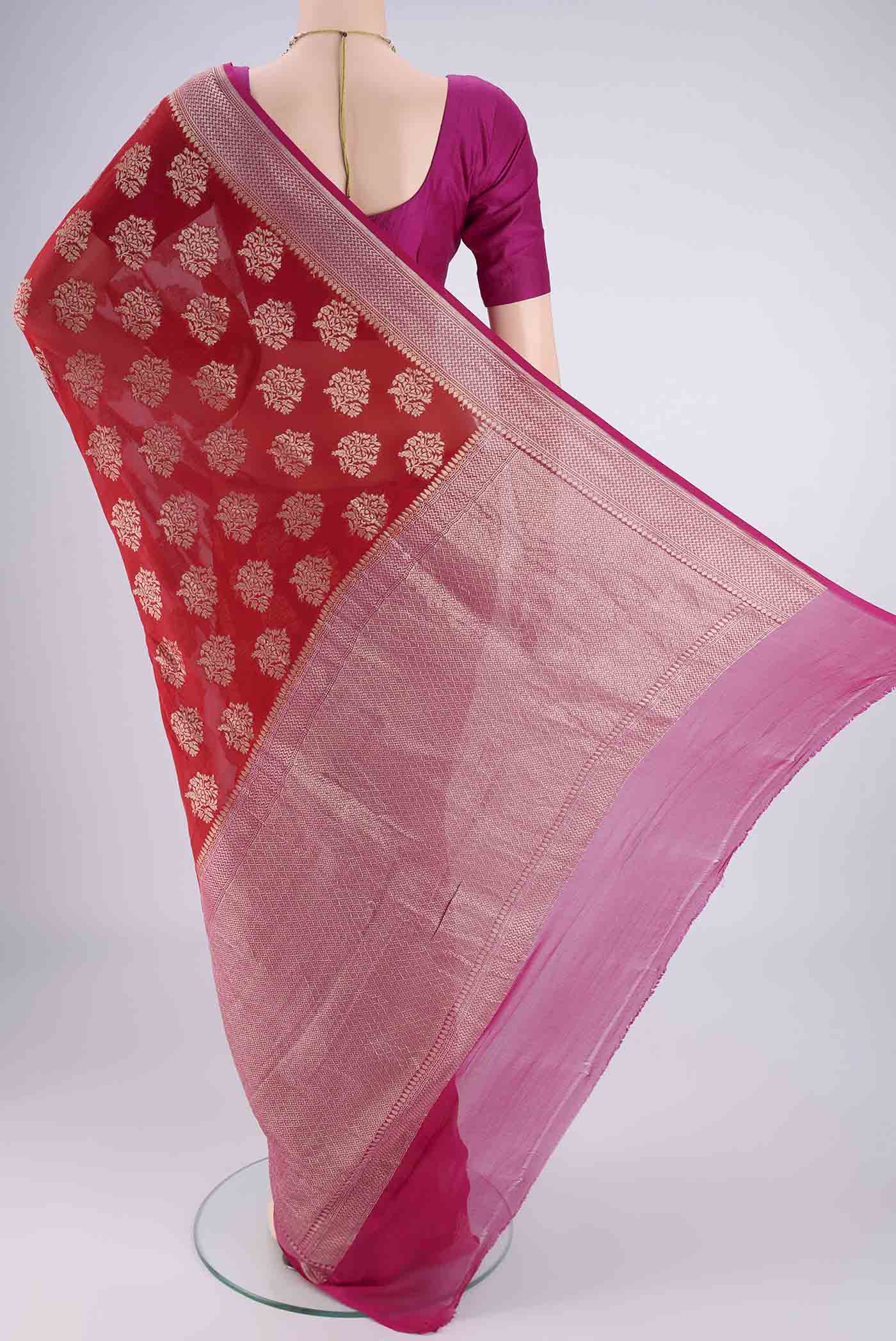 Flat view of Red Banarasi Georgette Saree with Zari Brocade on the body and Zari Border. 
