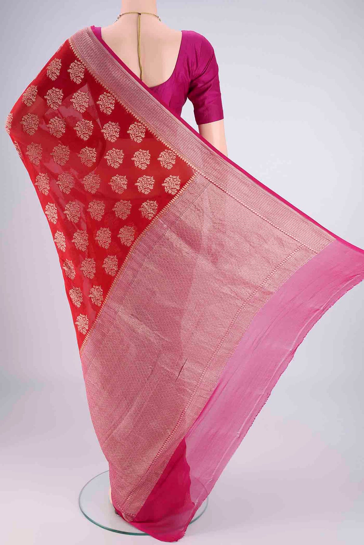 Flat view of Red Banarasi Georgette Saree with Zari Brocade on the body and Zari Border. 