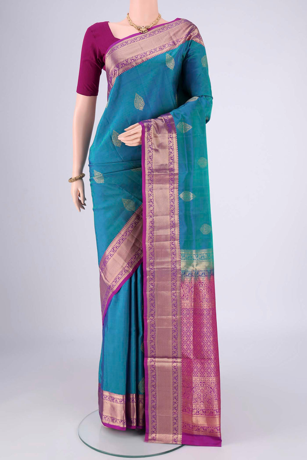 Blue Dual Tone Soft Silk Saree with Zari Butta on the body and Zari Border.  displayed on a mannequin