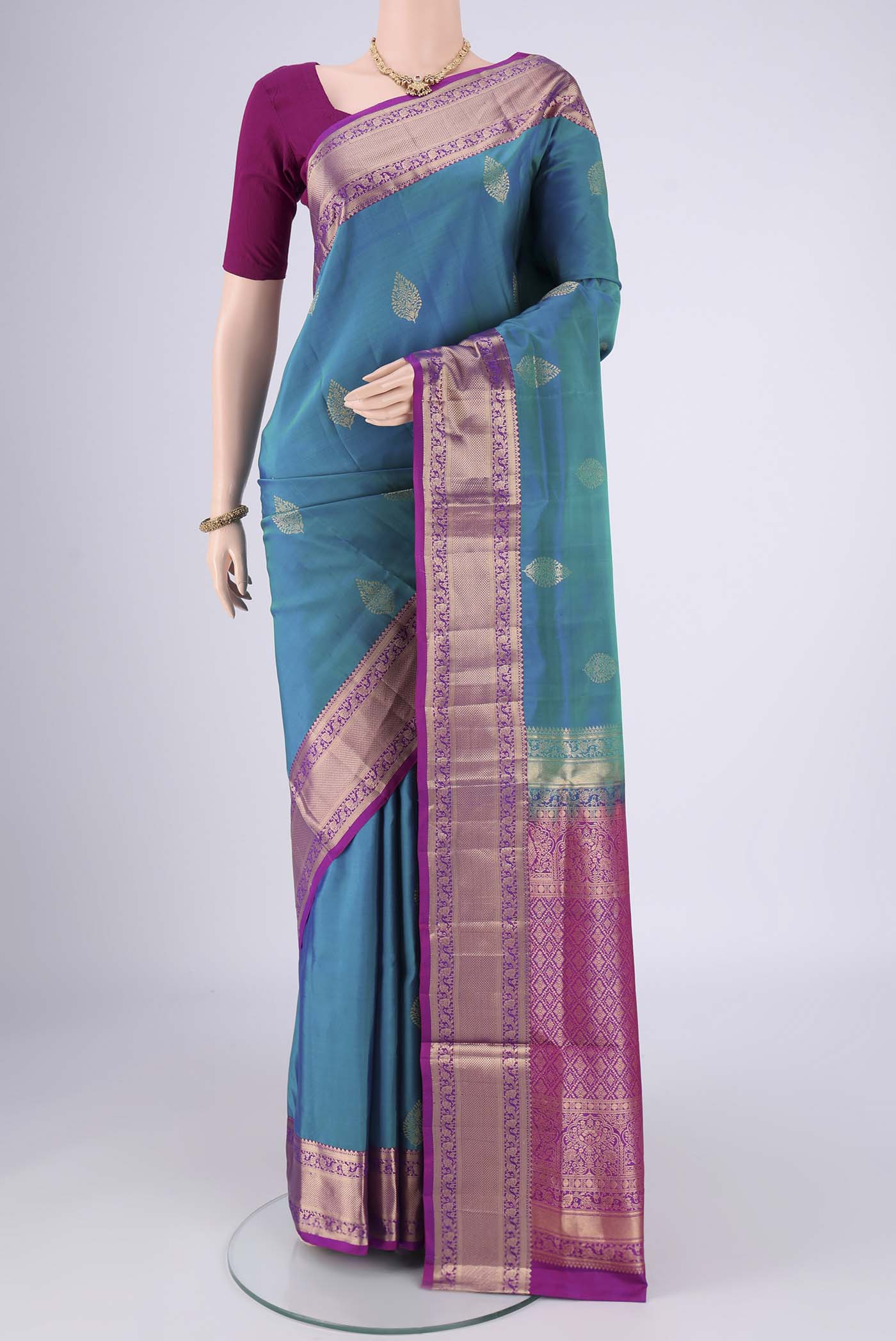 Blue Dual Tone Soft Silk Saree with Zari Butta on the body and Zari Border.  displayed on a mannequin