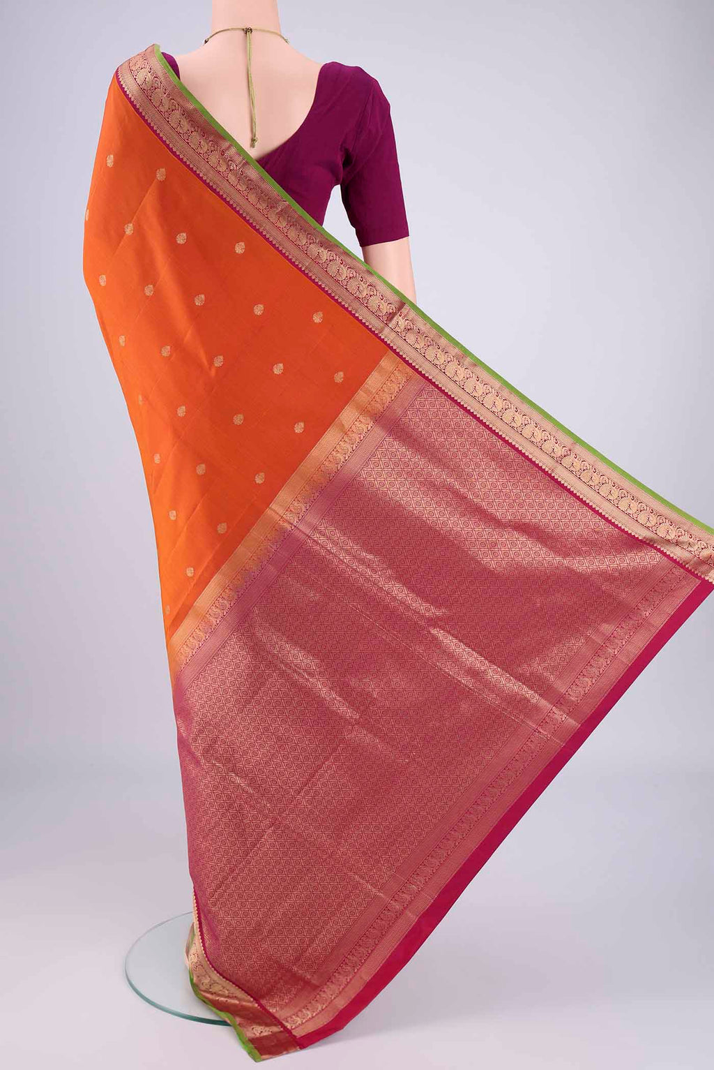 Flat view of Rust Dual Tone Soft Silk Saree with Zari Brocade on the body and Zari Border. 