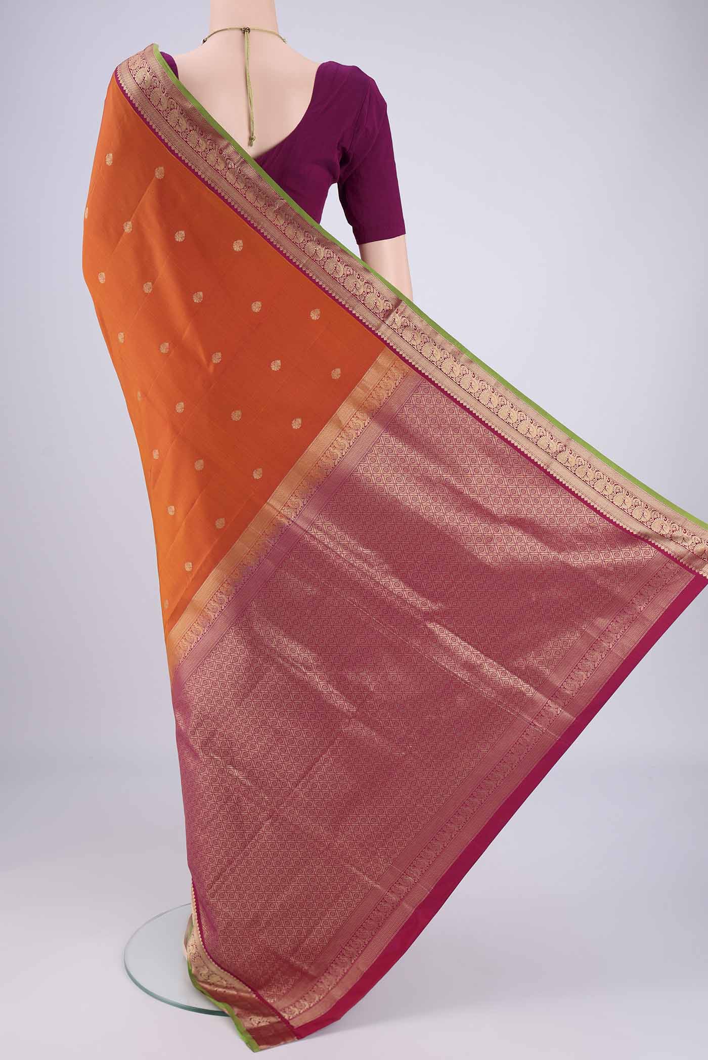 Flat view of Rust Dual Tone Soft Silk Saree with Zari Brocade on the body and Zari Border. 