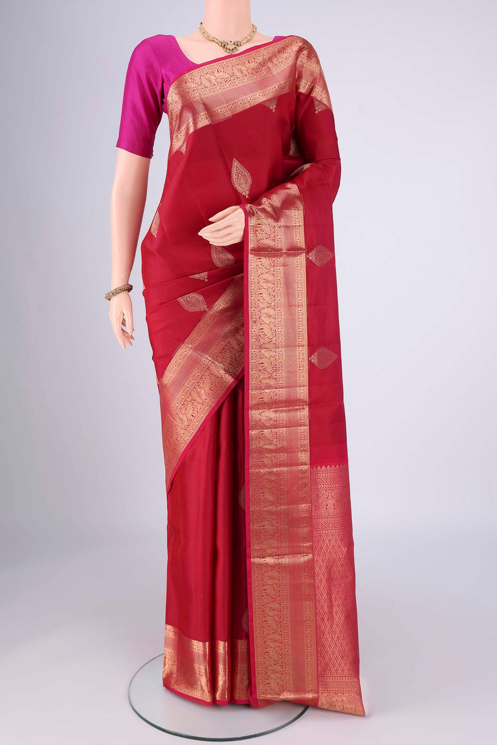 Maroon Dual Tone Soft Silk Saree with Zari Brocade on the body and Zari Border.  displayed on a mannequin