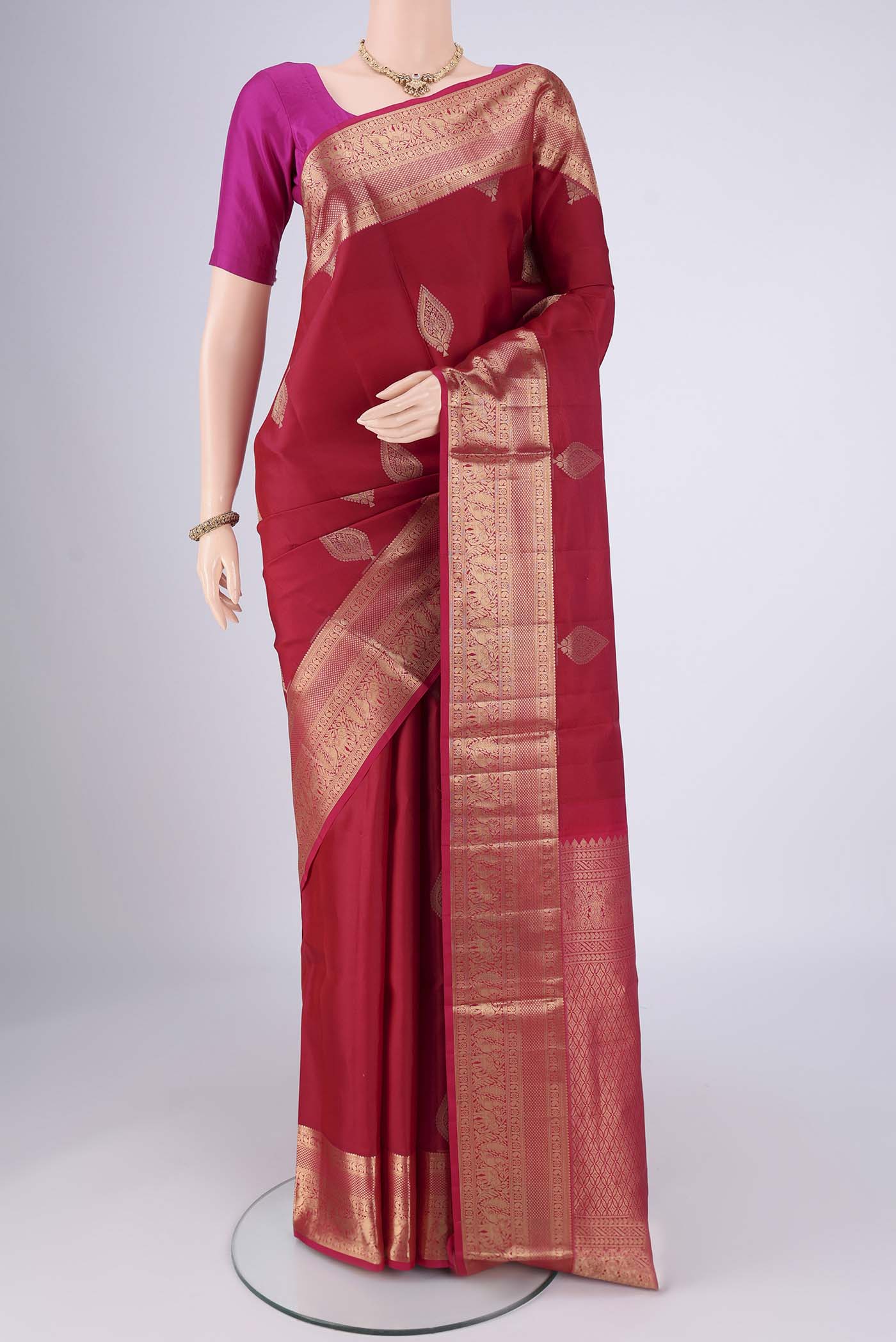 Maroon Dual Tone Soft Silk Saree with Zari Brocade on the body and Zari Border.  displayed on a mannequin