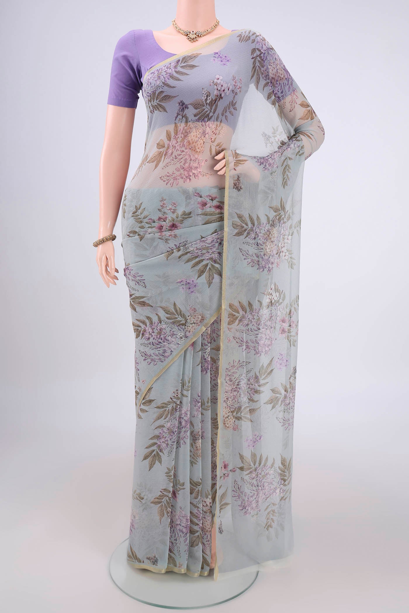 Blue Grey Mysore Chiffon Saree with Floral Print on the body and Thin Zari Line.  displayed on a mannequin