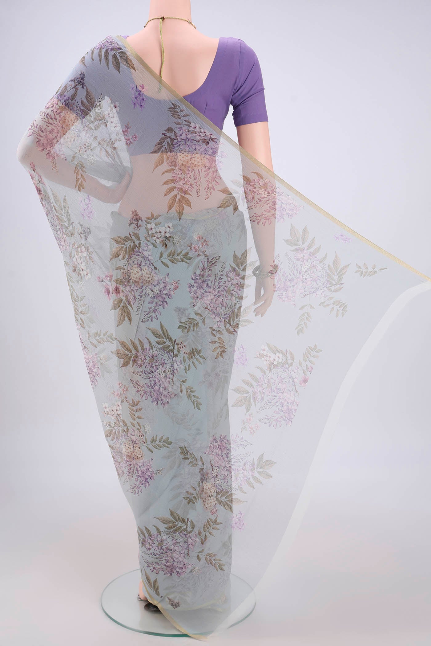 Flat view of Blue Grey Mysore Chiffon Saree with Floral Print on the body and Thin Zari Line. 