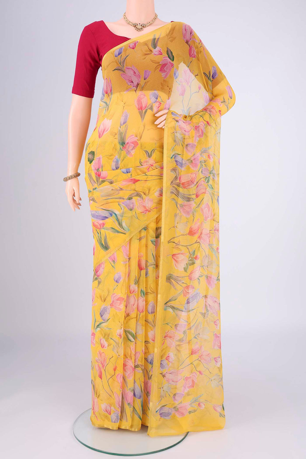 Yellow Mysore Chiffon Saree with Floral Print on the body and Thin Zari Line.  displayed on a mannequin