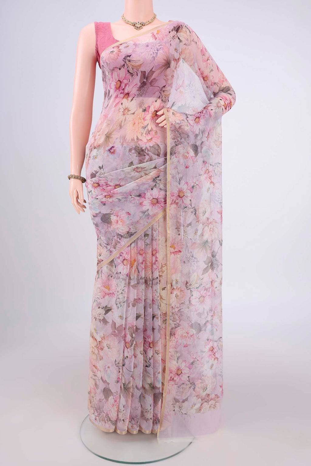Rose pink Mysore Chiffon Saree with Floral Print on the body and Thin Zari Line.  displayed on a mannequin