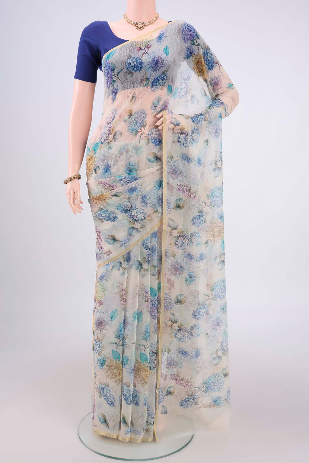 Off White Mysore Chiffon Saree with Floral Print on the body and Thin Zari Line.  displayed on a mannequin