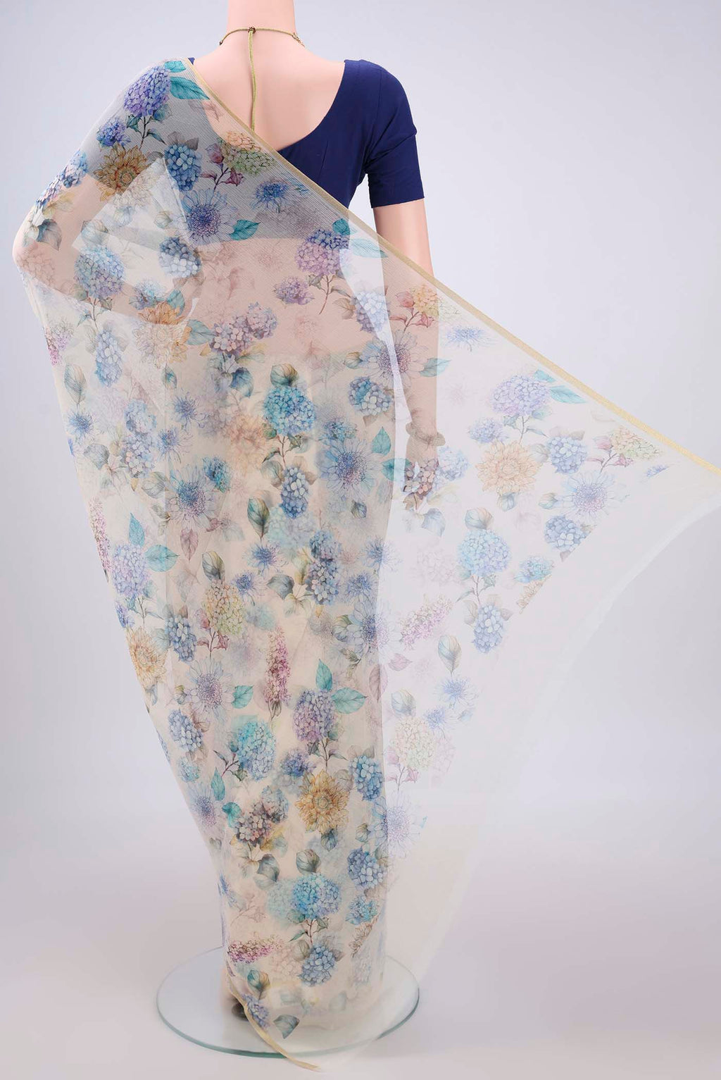 Flat view of Off White Mysore Chiffon Saree with Floral Print on the body and Thin Zari Line. 