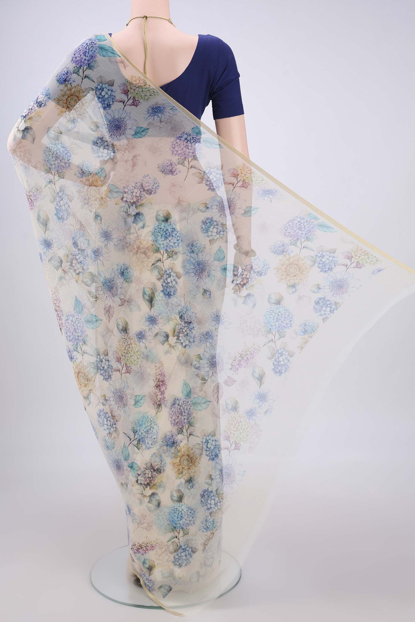 Flat view of Off White Mysore Chiffon Saree with Floral Print on the body and Thin Zari Line. 