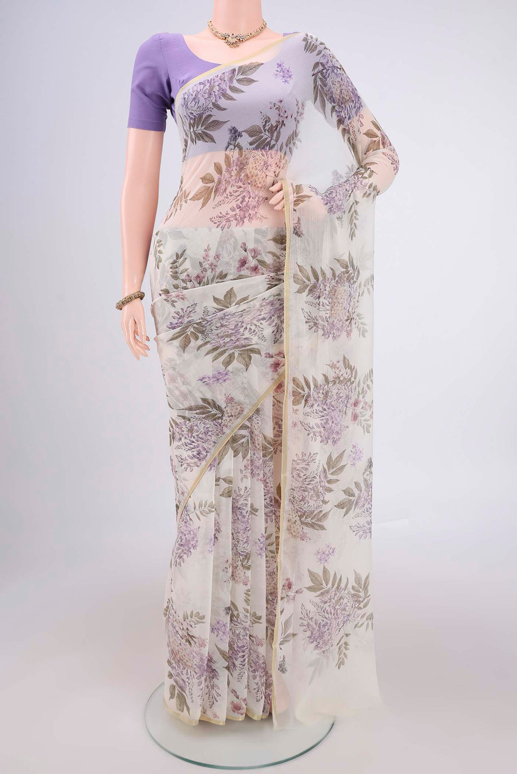 White Mysore Chiffon Saree with Floral Print on the body and Thin Zari Line.  displayed on a mannequin