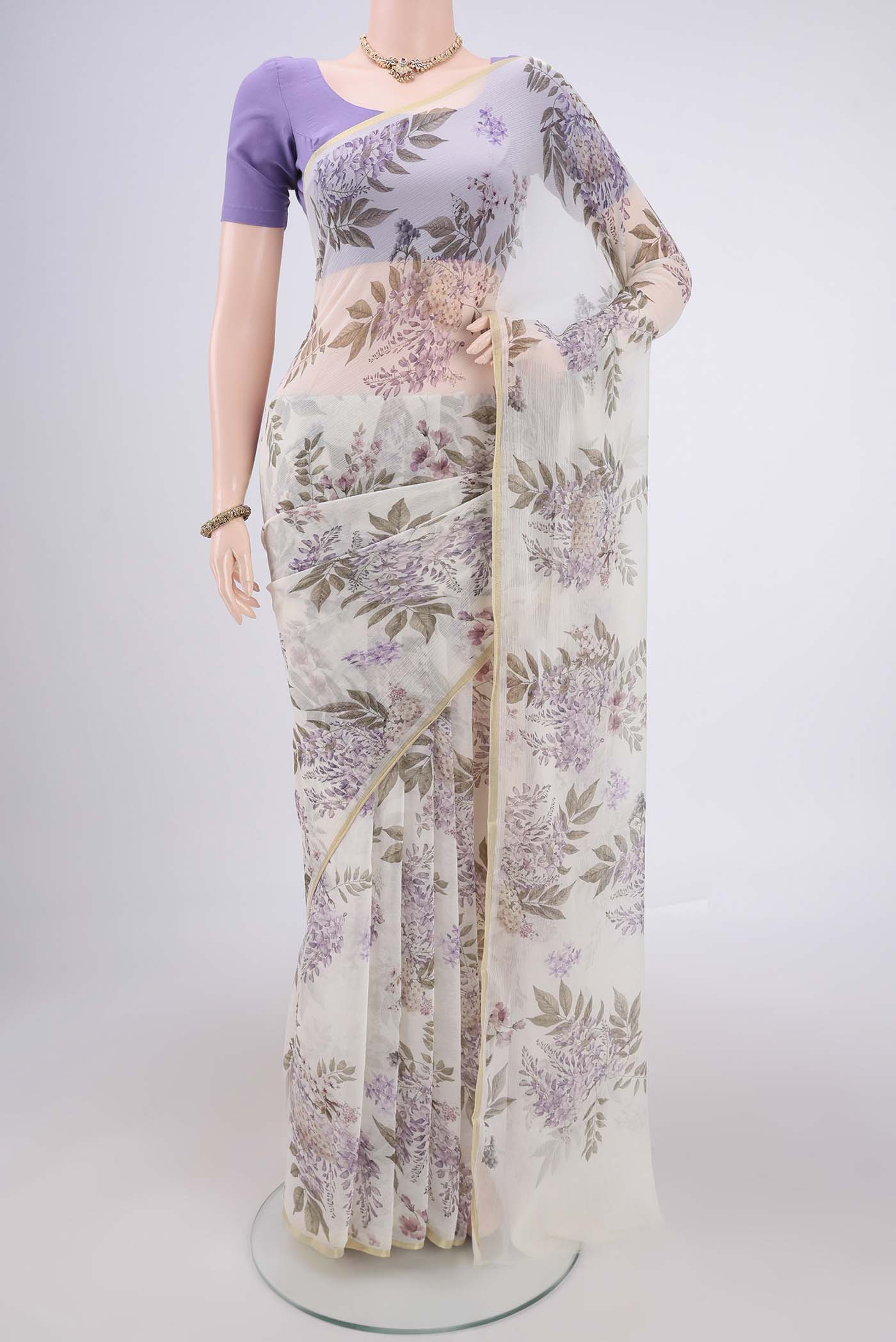 White Mysore Chiffon Saree with Floral Print on the body and Thin Zari Line.  displayed on a mannequin