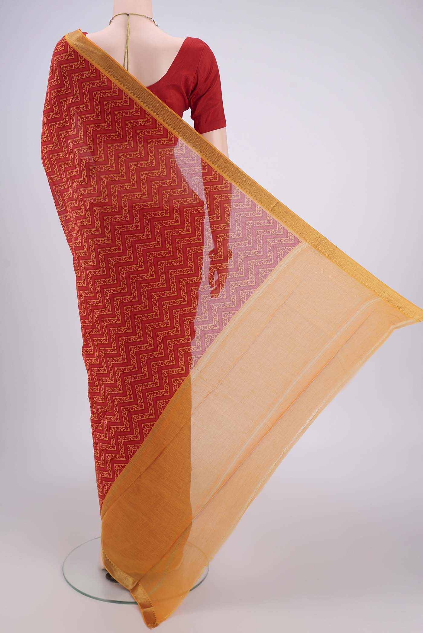 Flat view of Red Mangalagiri Cotton Saree with Printed design on the body and Zari Border. 