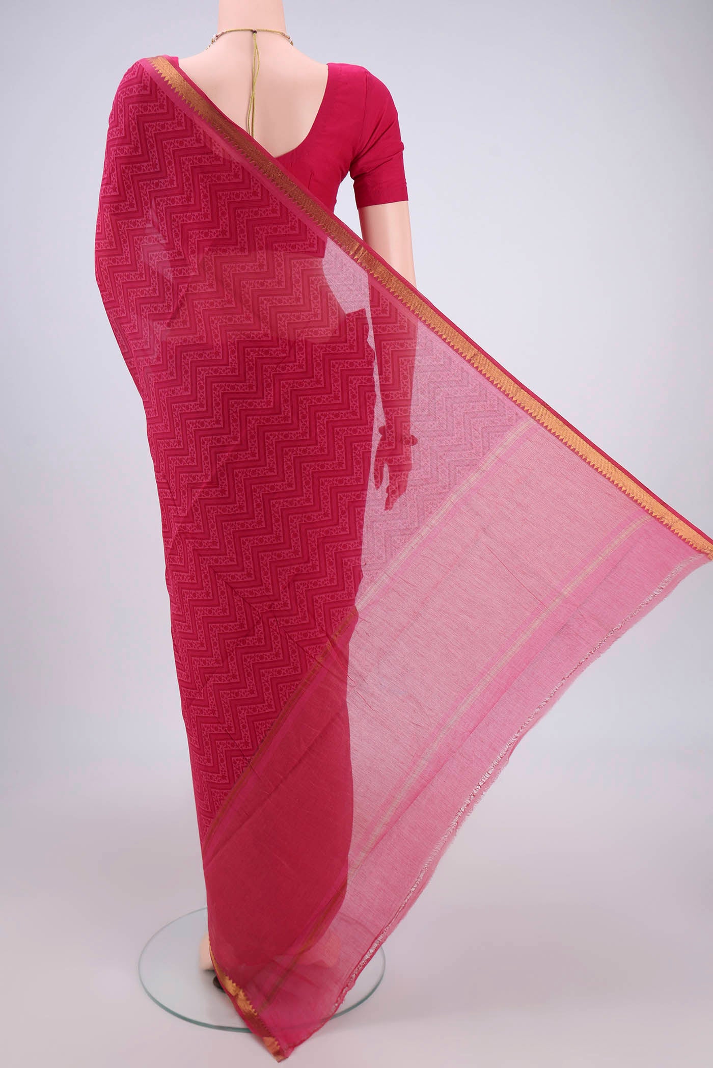 Flat view of Dark Pink Mangalagiri Cotton Saree with Printed design on the body and Zari Border. 