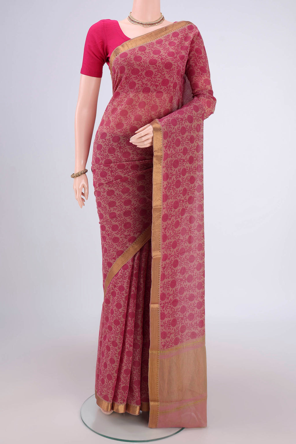 Pink Mangalagiri Cotton Saree with Printed design on the body and Zari Border.  displayed on a mannequin
