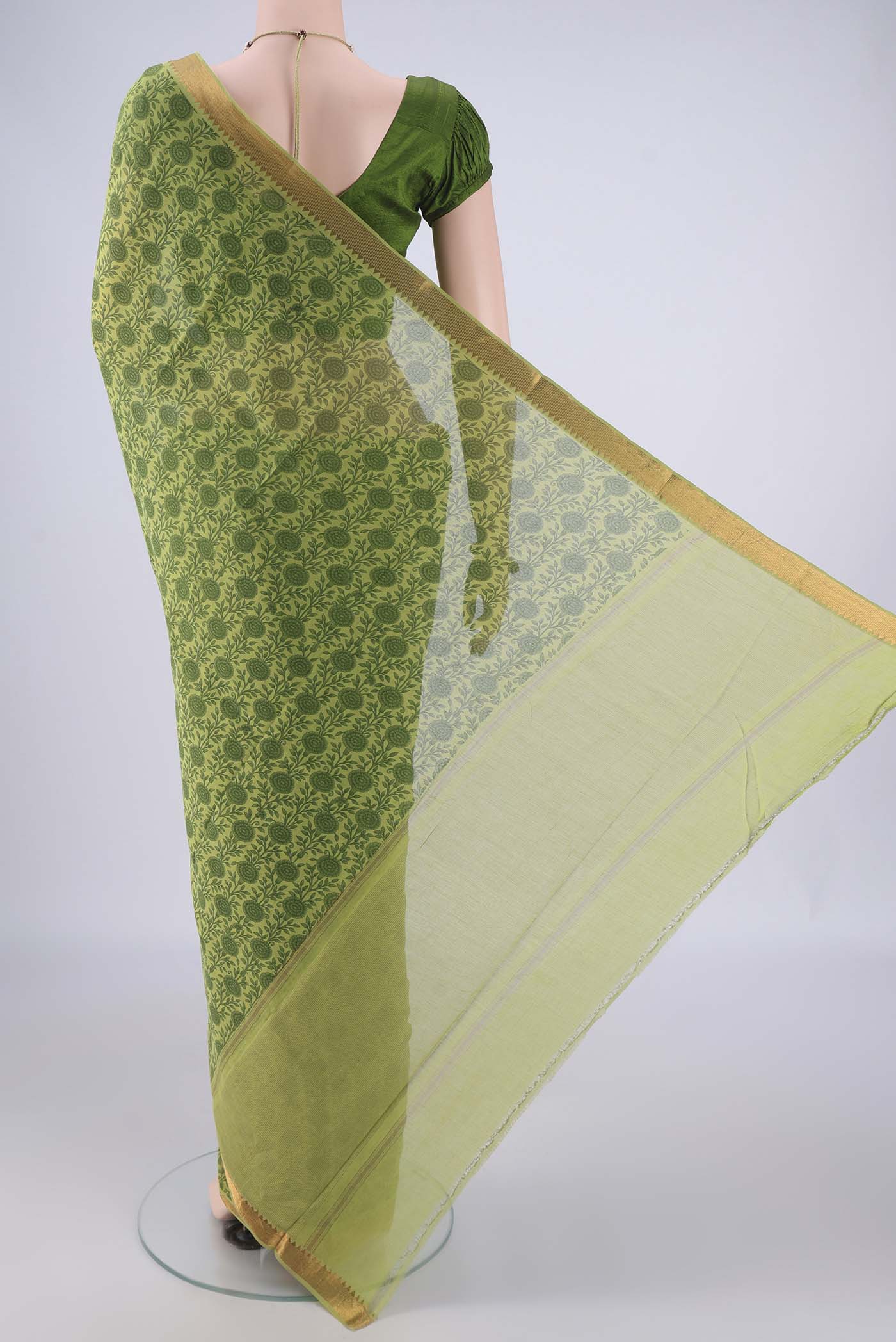 Flat view of Green Mangalagiri Cotton Saree with Printed design on the body and Zari Border. 