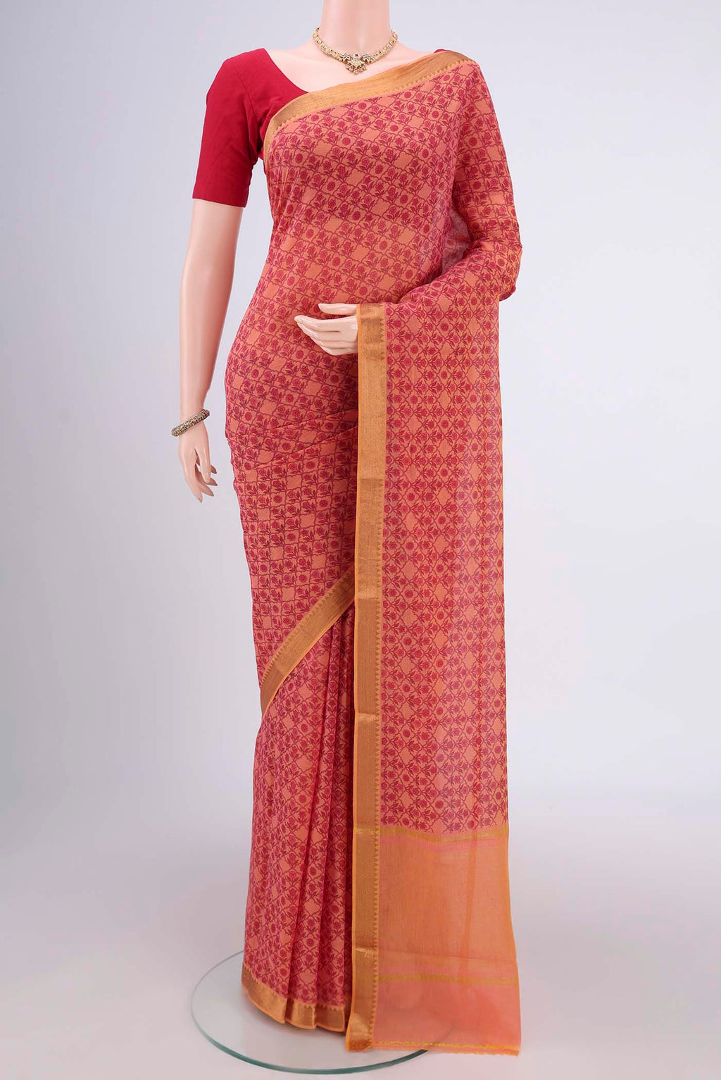 Salmon Mangalagiri Cotton Saree with Printed design on the body and Zari Border.  displayed on a mannequin
