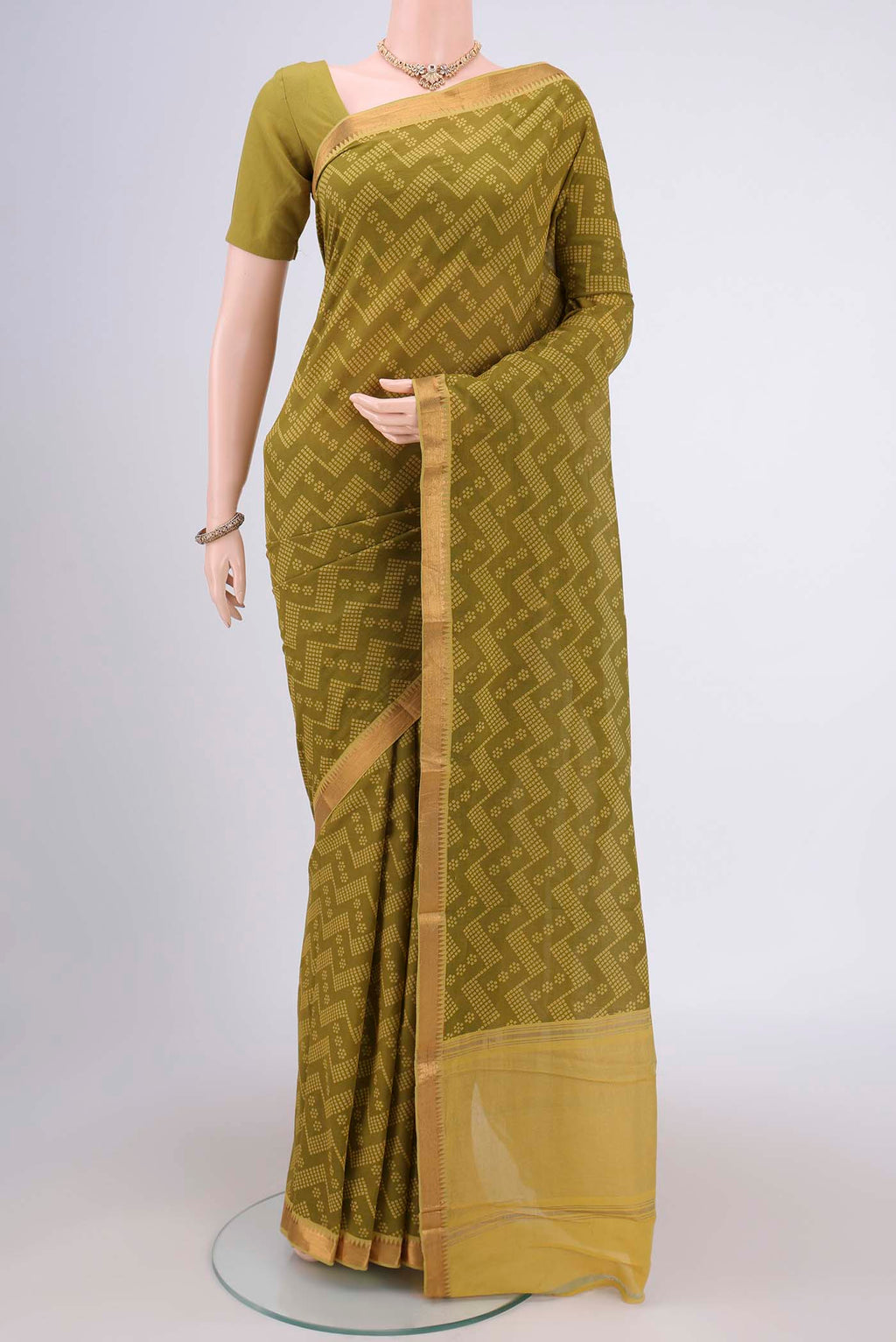 Mehandi Green Mangalagiri Cotton Saree with Printed design on the body and Zari Border.  displayed on a mannequin