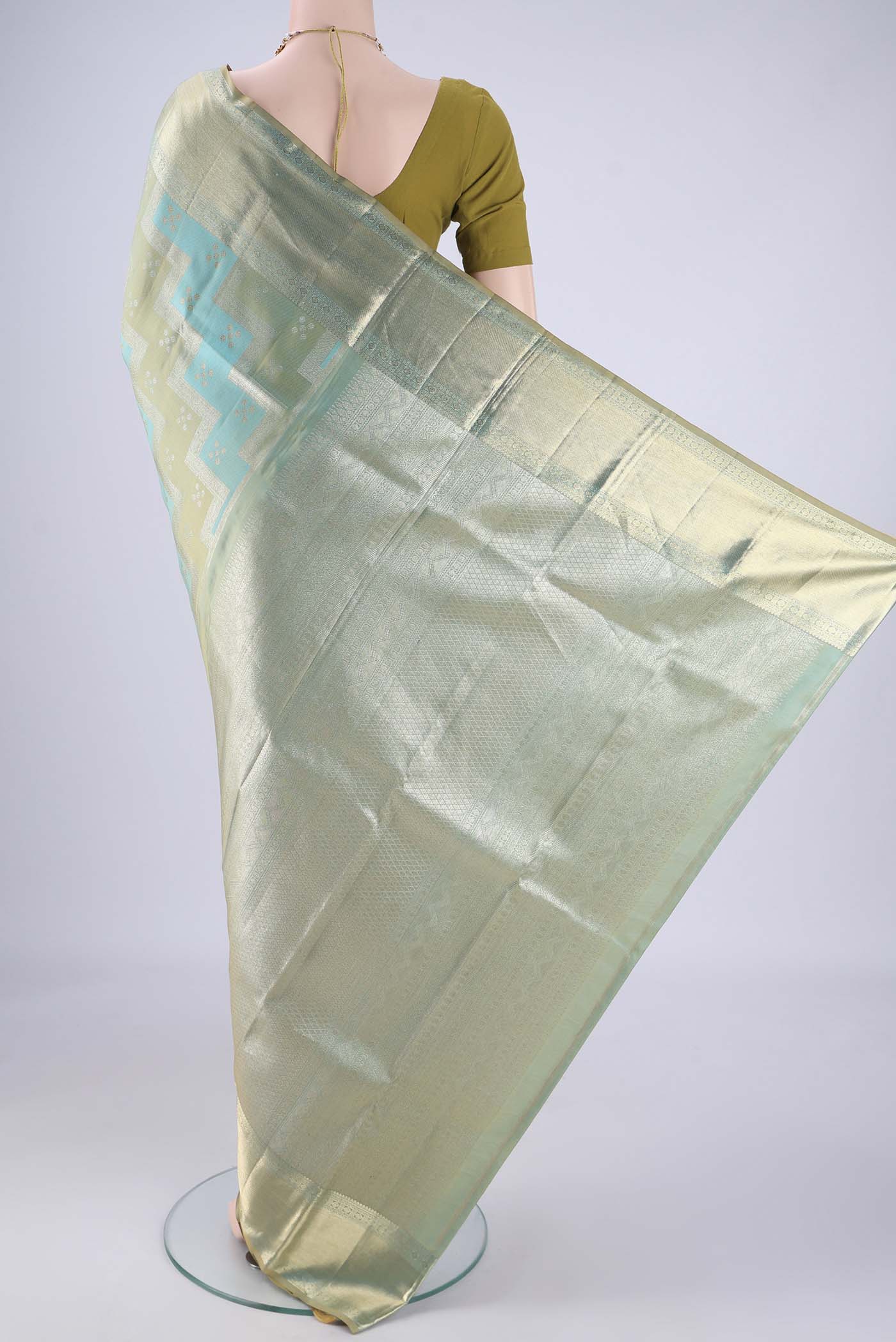 Flat view of Turquoise Kanjivaram Silk Saree with Zari Brocade on the body and Zari Border. 