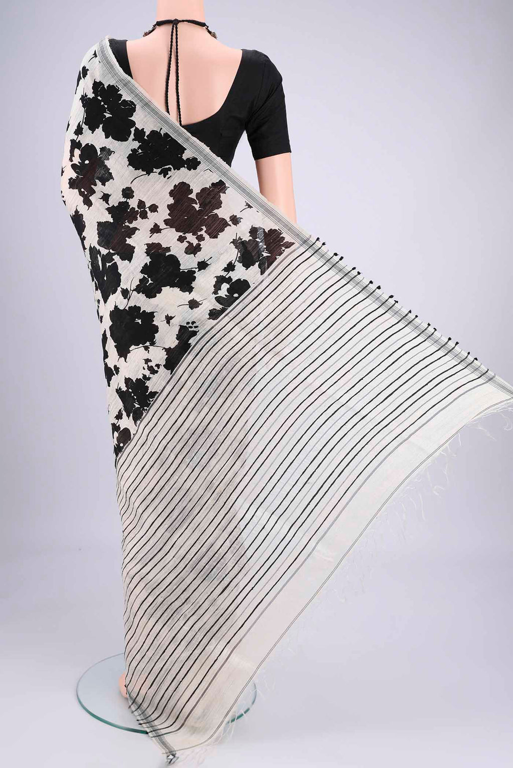 Flat view of Off White Tussar Silk Saree with Floral Print on the body and Plain Border. 